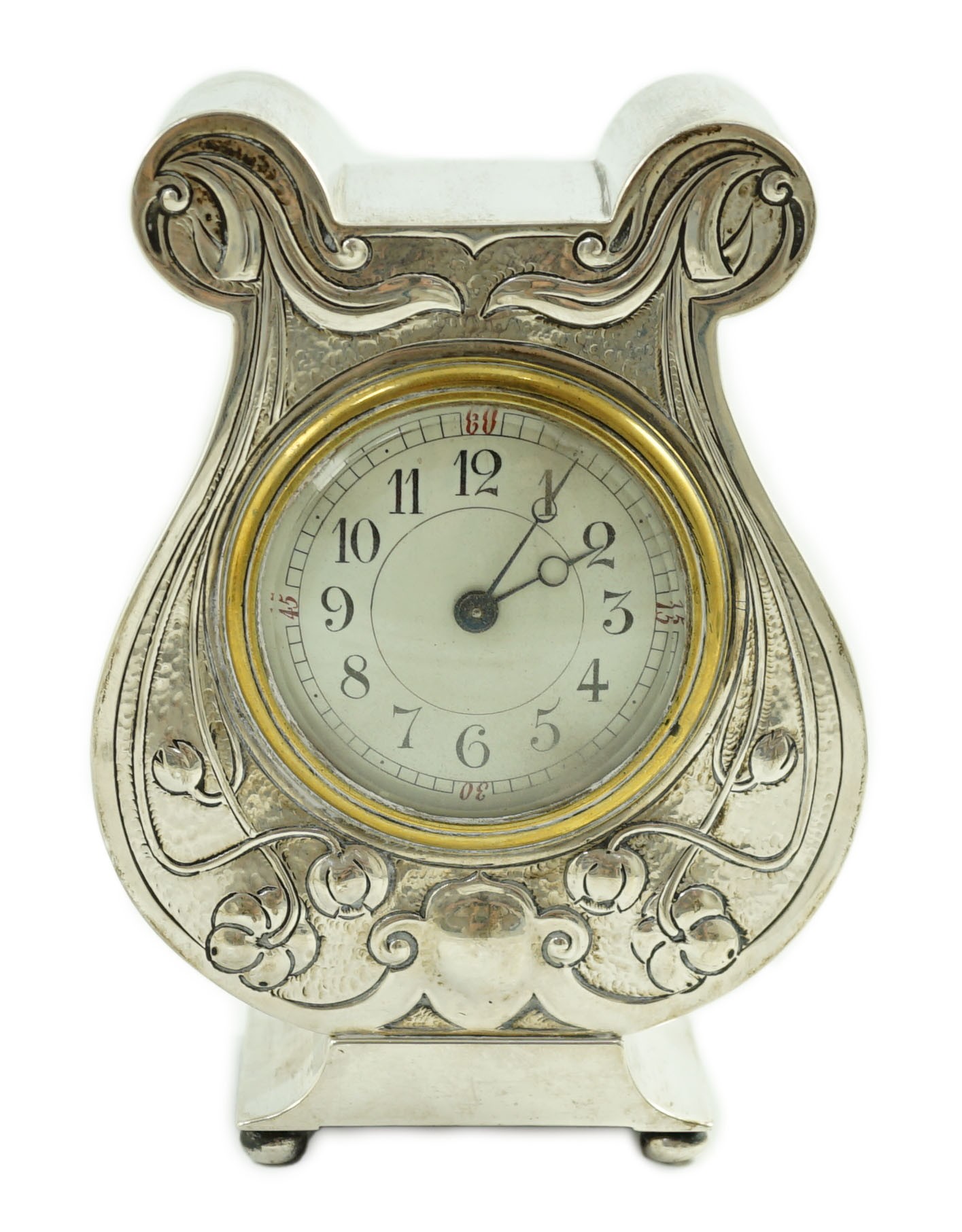 An Edwardian Art Nouveau silver cased mantel timepiece